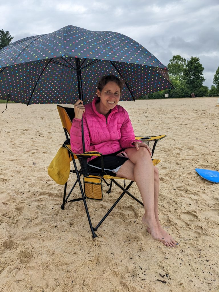 Cassy taking shelter from the rain