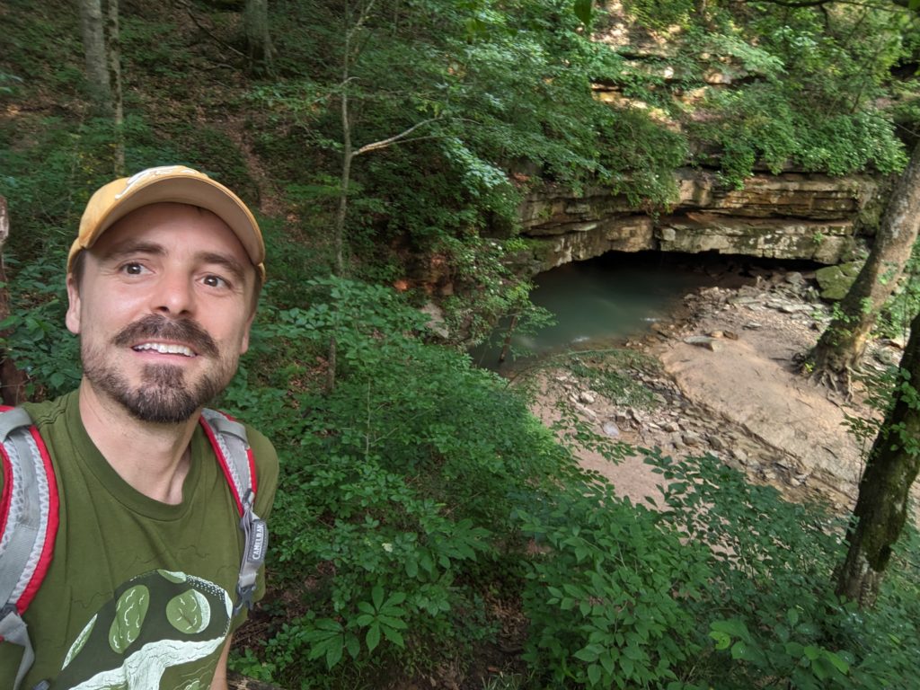 The Author standing next to the underground river Styx where it flows out of Mammoth Cave into the green river.