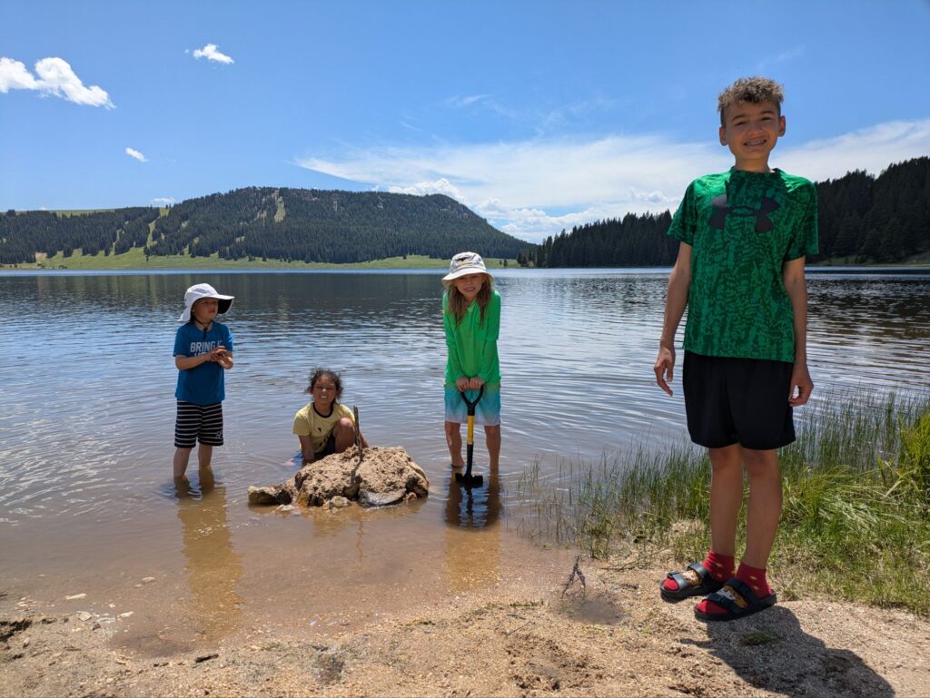Boys having a sand castle jam on Meadowlark Lake walking distance from our campsite!