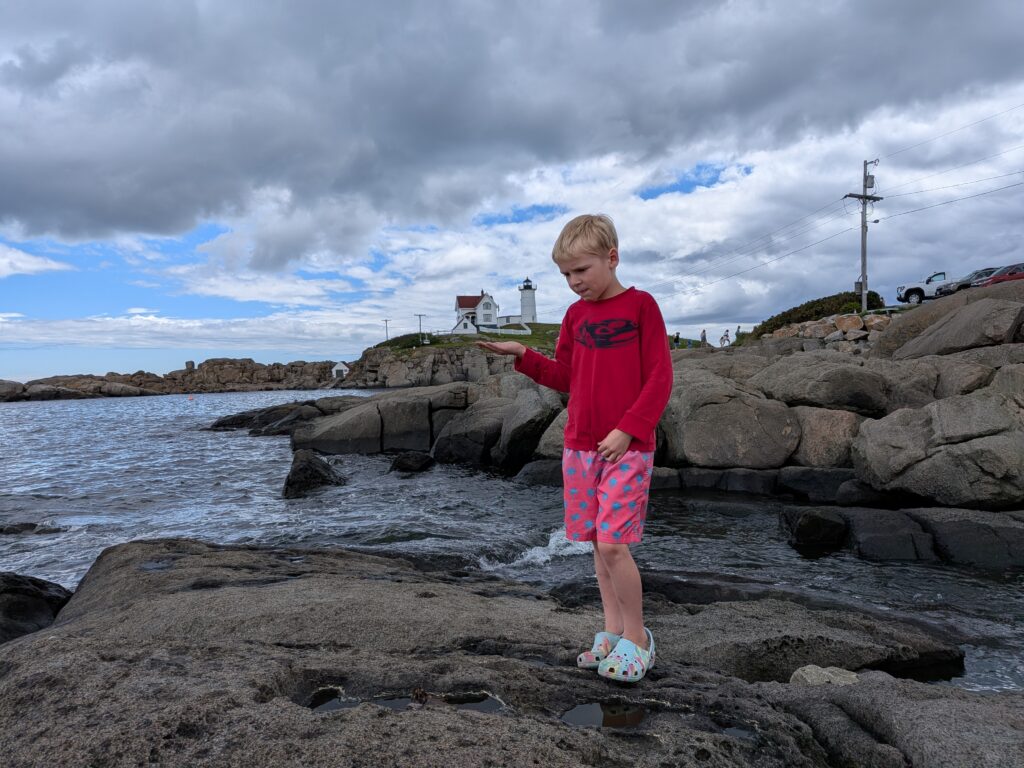 Madison holding up Nubble Light gave us the classic Maine lighthouse moment.