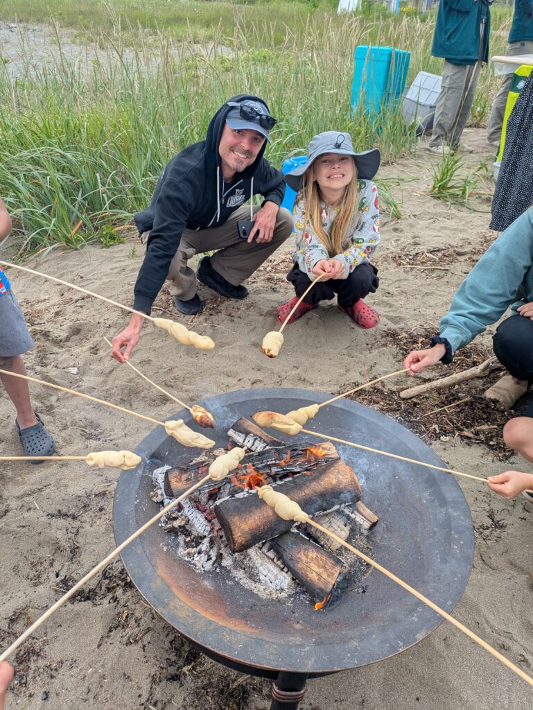 Lincoln and Dad Roasting up Luskinikn (dough) Bathed in Maple Syrup